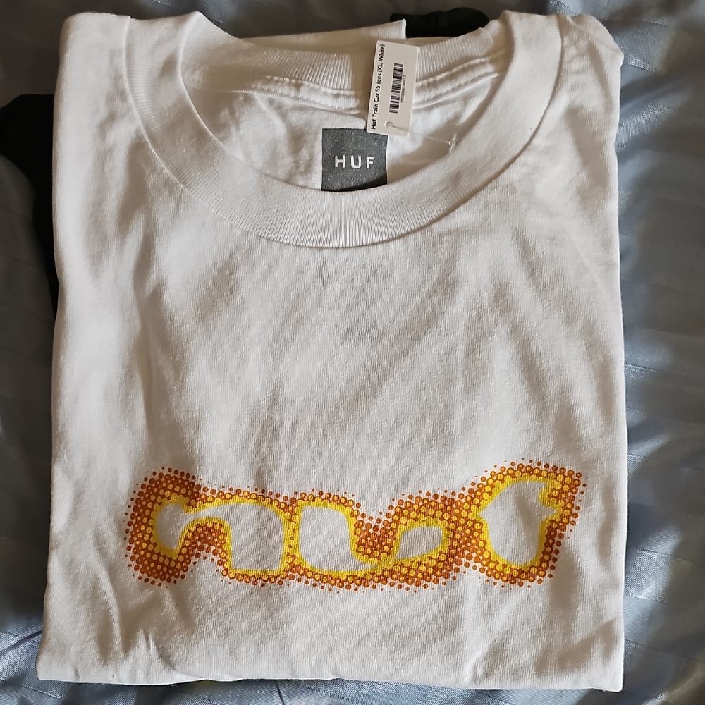 HUF White Tee with Vibrant Yellow and Orange Design